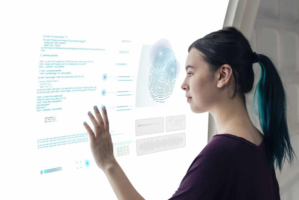 Girl coding on an interactive screen